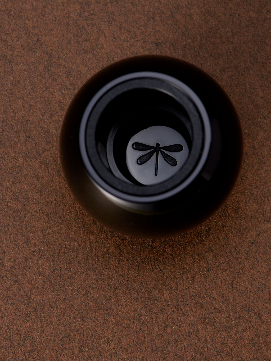 Perfume cap with may fly