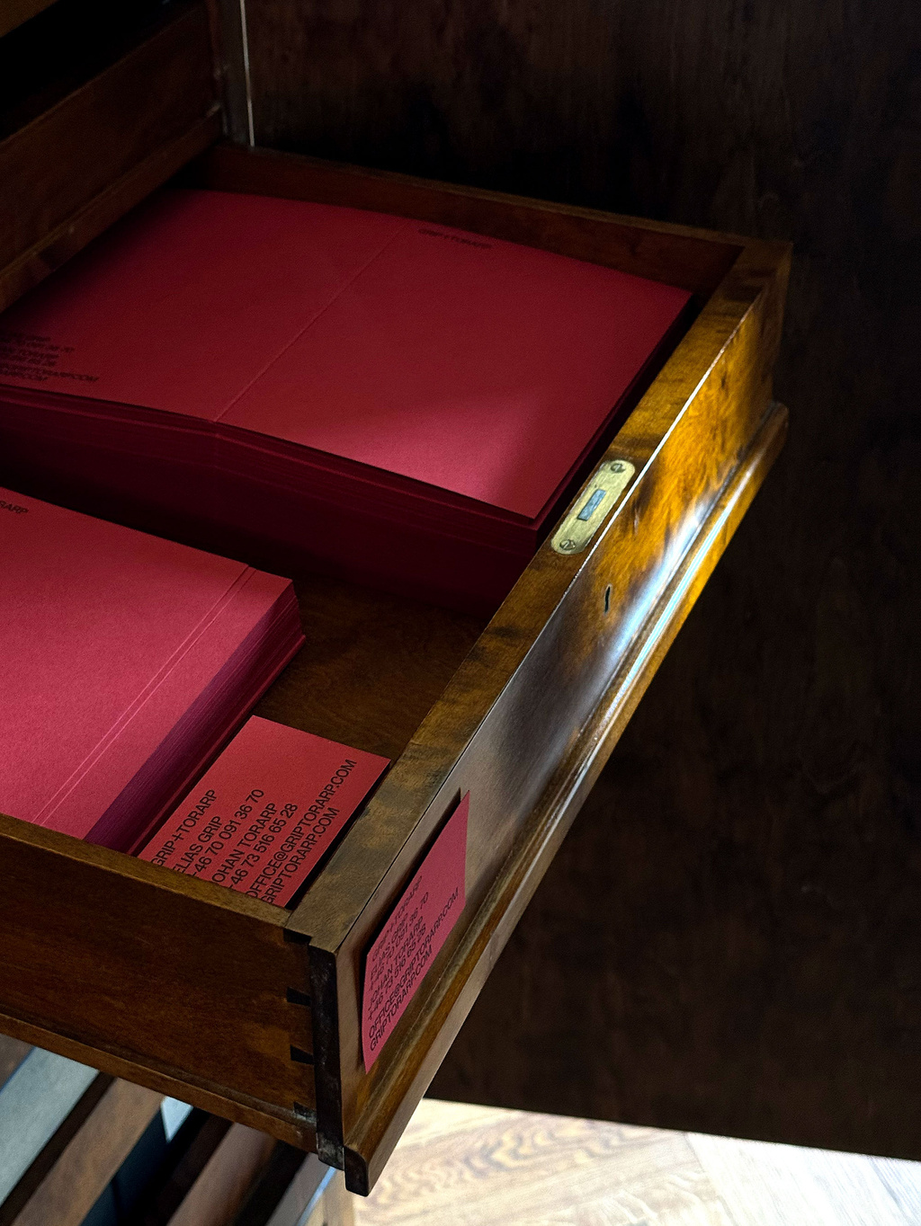 Open drawer holding stationary in red