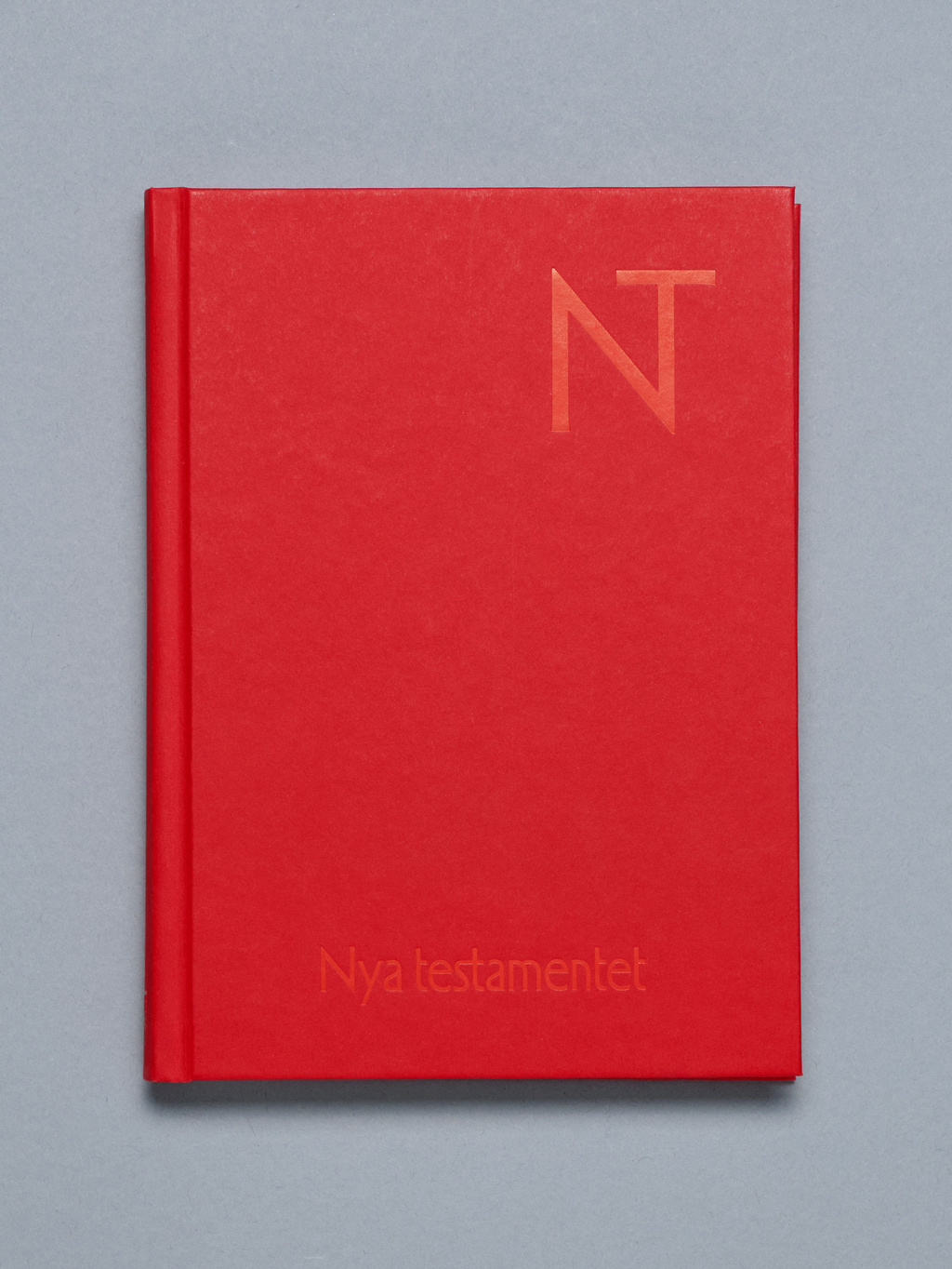 Red book with The New Testament