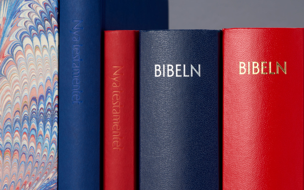 A range of red and blue bibles