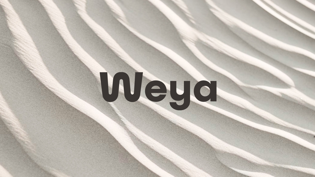 Weya logotype on sand